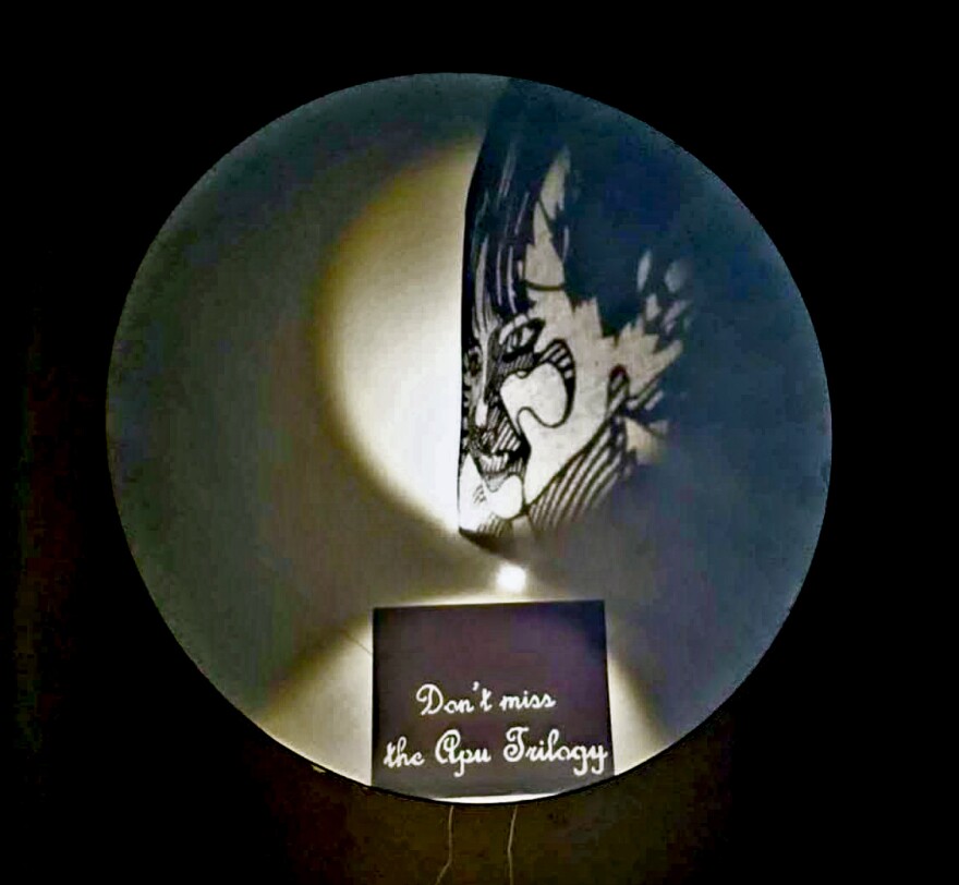 Michael Proft's artwork that hung in the stairway of the Hillcrest Cinemas to promote the Apu Trilogy. Undated photo.