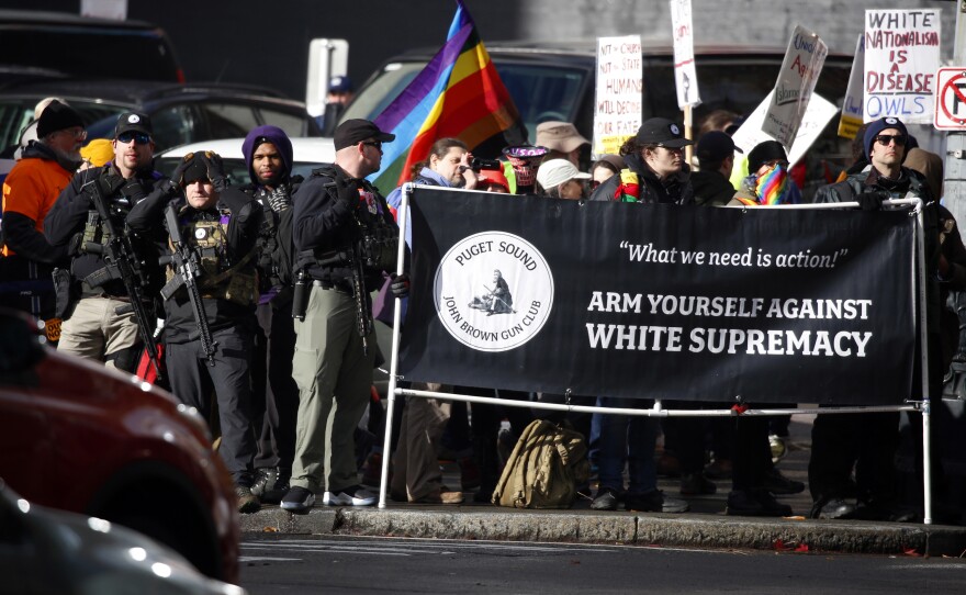 Members of the Puget Sound John Brown Gun Club provide security to counterprotesters at a far-right rally in Seattle on Jan. 5.