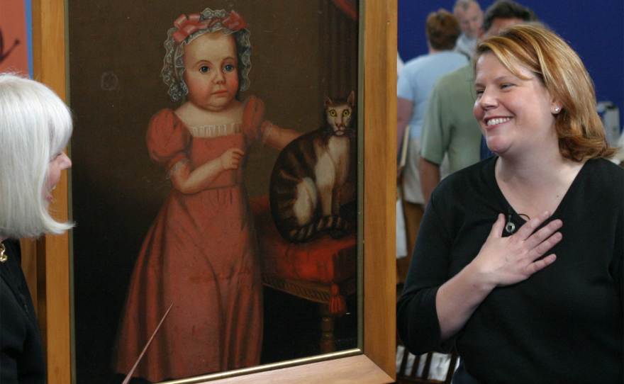 Marybeth Keene (left) appraises a folk art portrait, ca. 1830 in Portland, Ore.
