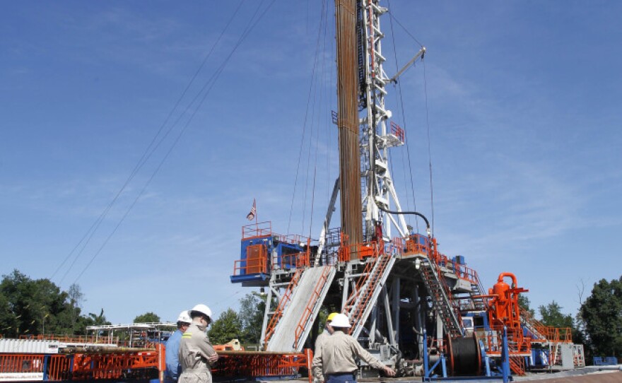 Natural gas is much cleaner than coal. But some energy analysts say an overabundance of the fuel could depress development in even cleaner energy sources like wind and solar power. Above, a rig in Washington, Pa., drills into shale rock to extract natural gas.