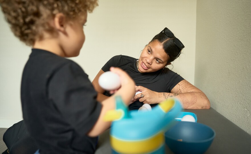 Barnes and her son eat breakfast before starting their day. Barnes is studying Business Administration at San Antonio College, and Samuel spends his days in a Head Start classroom on campus.