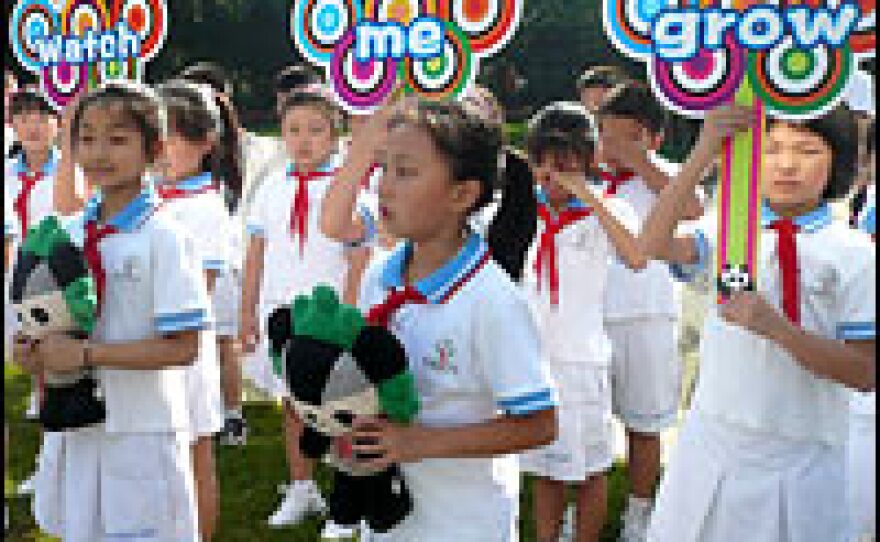 Schoolchildren in China's Sichuan province participate in the launch of <em>Panda: Watch Me Grow</em>. Profits from the book will go toward the panda center in Chengdu, which predicts it will lose more than $1 million in revenue from the drop in visitors following the earthquake.