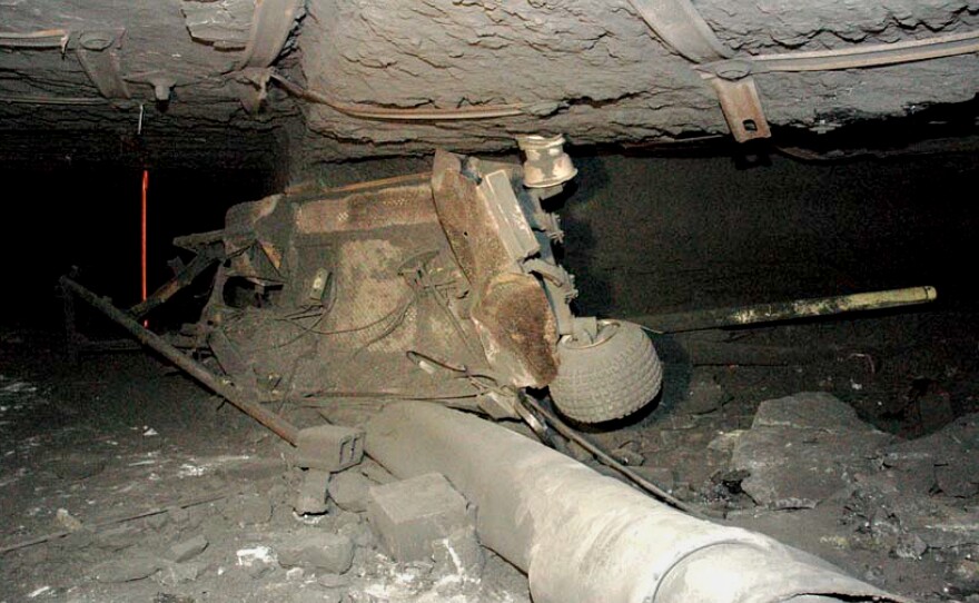 A personnel carrier that once carried miners underground at the Kentucky Darby mine was left crushed and twisted by a 2006 explosion, which left five workers dead.