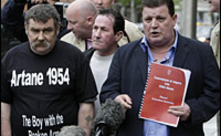 Kevin Flannigan, left, and John Kelly from the group Survivors of Child Abuse, protest in Dublin, Ireland, at not being allowed into the launch of a long-awaited report on child abuse in the Catholic Church, May 20, 2009. The report revealed that the Catholic Church was aware long-term sex offenders were repeatedly abusing children while working in Ireland's church and state-run institutions.