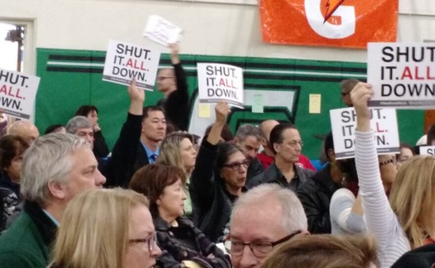 Signs asking for the complete closure of the Aliso Canyon Gas Storage facility, which Southern California Gas considers an essential asset, are beginning to appear at rallies held by residents of Porter Ranch, Jan. 9, 2016.