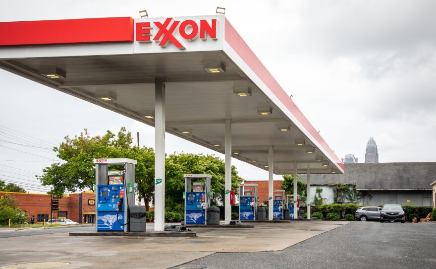 Pictured are pumps at an ExxonMobil's gas station in Charlotte, N.C., on May 12. A tiny fund got two board members elected to the oil giant's board, delivering a historic defeat to ExxonMobil.