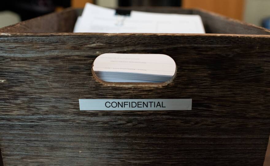 A box of past temporary restraining orders from the court waiting to be picked up by clients at the Sacramento Regional Family Justice Center in Sacramento on Nov. 1, 2021.