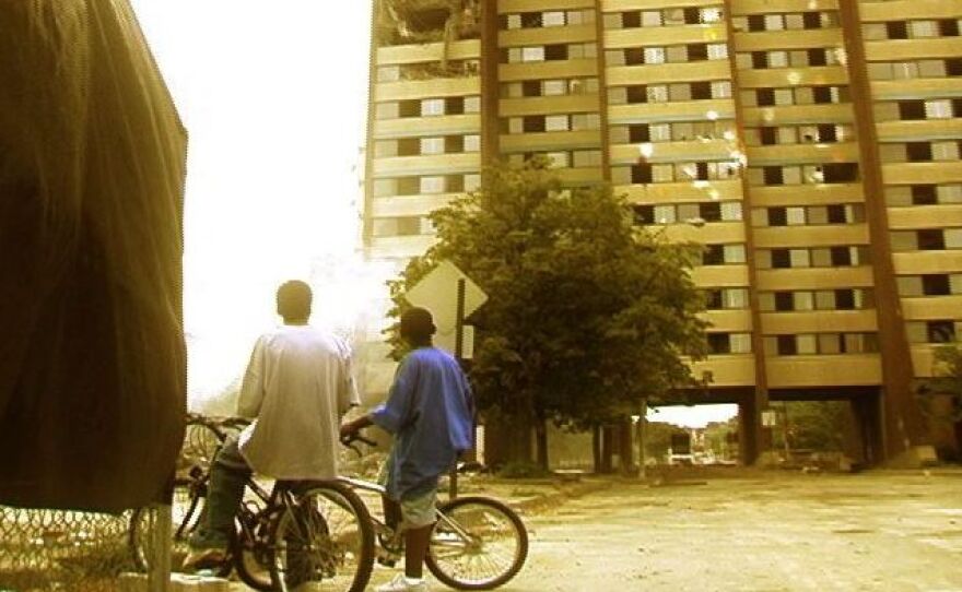 This still from the documentary film "East of Liberty" shows two young boys in Pittsburgh looking up at a building facing demolition.