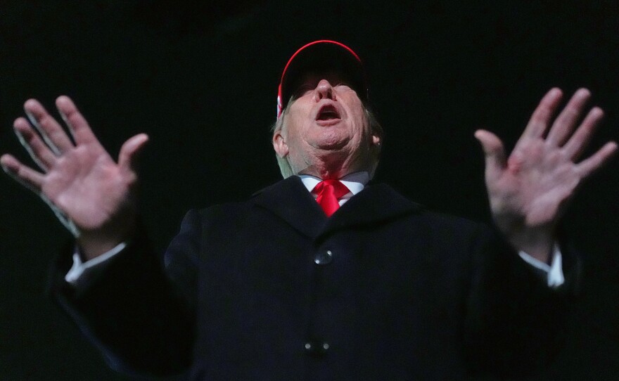 President Donald Trump speaks with reporters at Joint Base Andrews, Md., Sunday, April 12, 2026, after he returned from Miami.