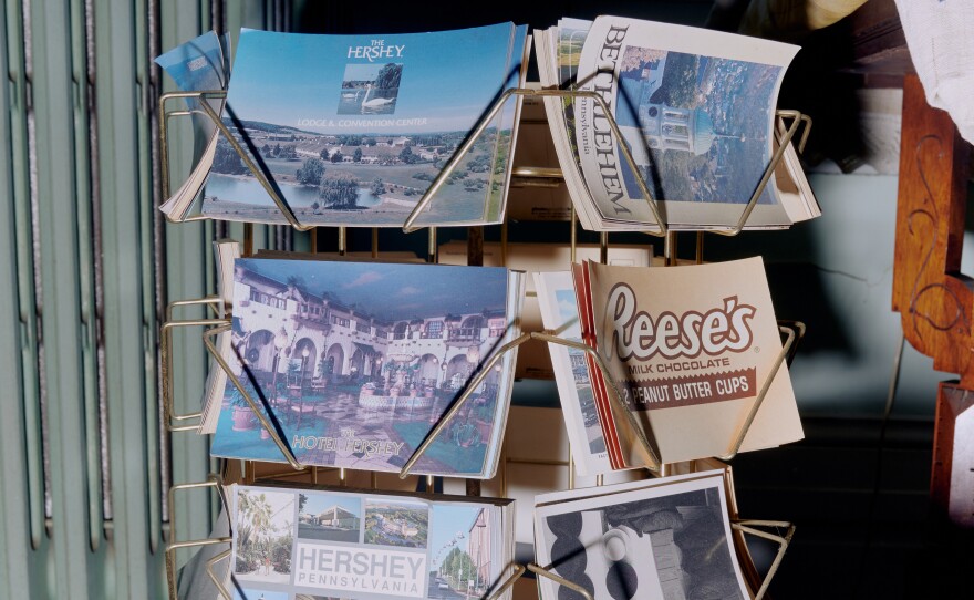 A rack of postcards from Hersheypark, the theme park in Hershey, Pa., inside Brown's home.