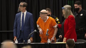 Joseph James DeAngelo, center, charged with being the Golden State Killer, his helped up by his attorney, Diane Howard, as Sacramento Superior Court Judge Michael Bowman enters the courtroom in Sacramento, Calif. Monday June 29, 2020.