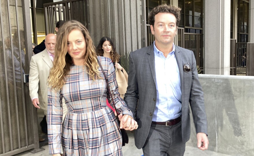 Actor Danny Masterson leaves Los Angeles superior Court with his wife Bijou Phillips after a judge declared a mistrial in his rape case in 2022.