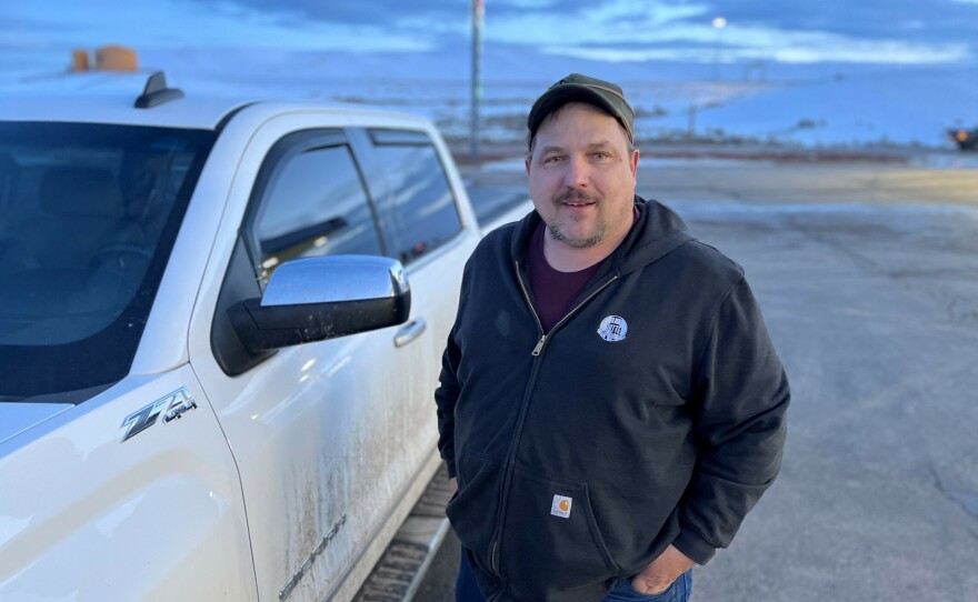 Cliff Green stands by his pickup after a shift at the Kemmerer Coal Mine, where he was grateful to find a new job after being laid off from another nearby mine.