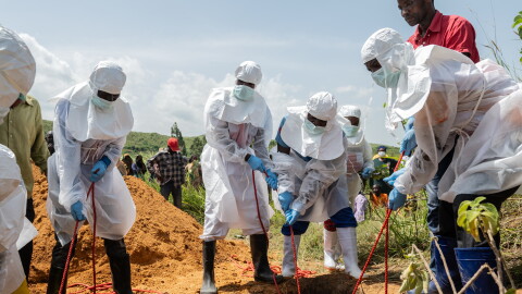 Red Cross workers bury an Ebola victim at the Rwampara Cemetery, in Rwampara, Congo, May 23, 2026.