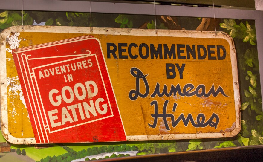 A roadside sign advertising Duncan Hines' Adventures in Good Eating is on display at the Kentucky Museum at Western Kentucky University.