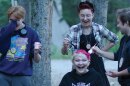 A group of teenagers help another camper dye their hair in this still from the film, "Summer Qamp."
