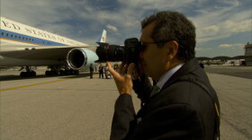 Pete Souza takes a photo of President Obama boarding Air Force One.