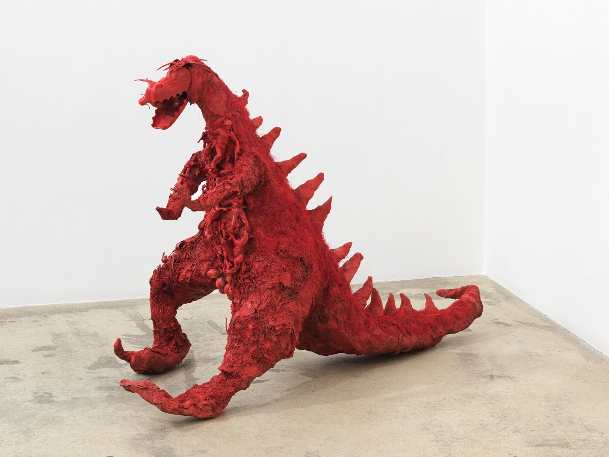 Niki de Saint Phalle's "Red Dragon," (1964), an assemblage of plaster, mesh fabric, spray paint, string, hair and plastic figures.