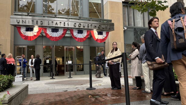 People line up outside the Oakland, California federal courthouse ahead of opening arguments in the trial that four state attorneys general are bringing against Meta Platforms, Inc.