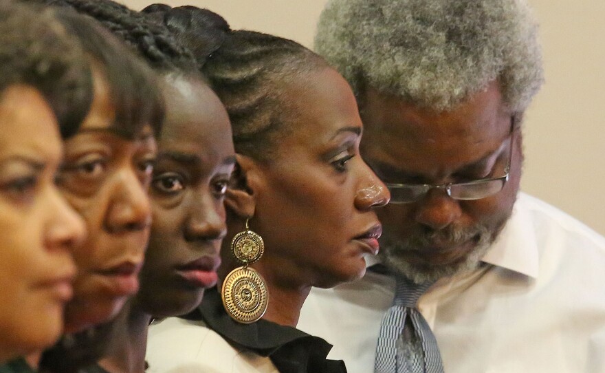 Pam Champion (second from right) and Robert Champion Sr. (right), parents of Robert Champion Jr., listen as the guilty verdict against Dante Martin is read in an Orlando courtroom on Friday.