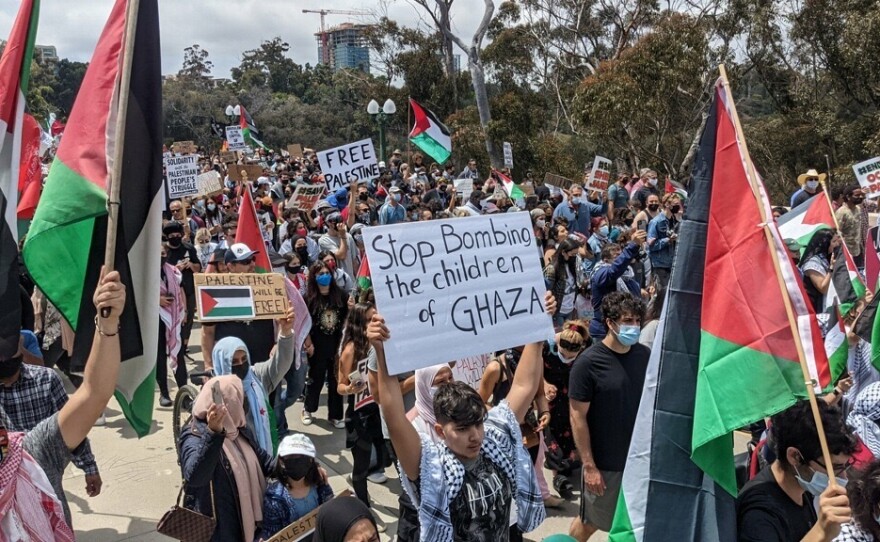Protestors gather and hold signs in Balboa Park to show their solidarity with Palestine, May 15, 2021.