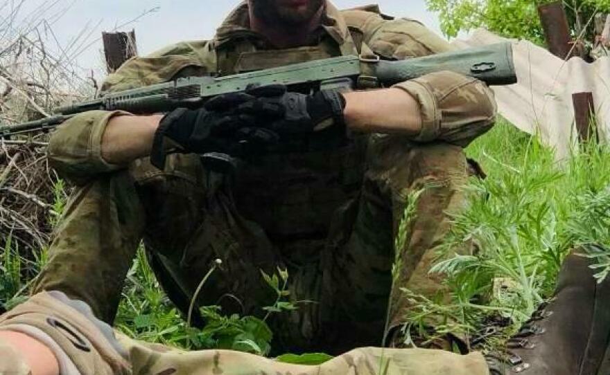 In this photo from the Campbell family, Christopher Campbell is seen on the front line or the war.