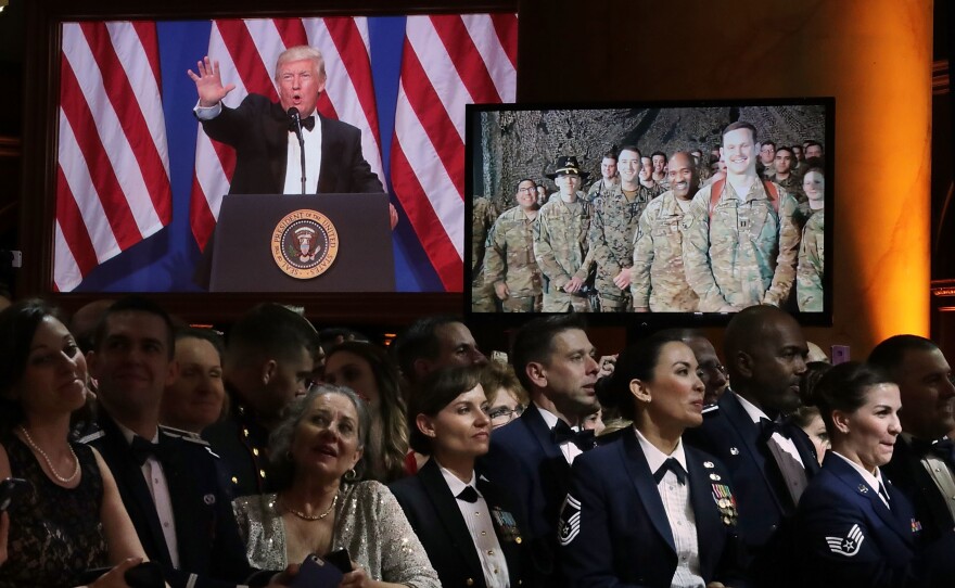 President Trump talks with service members in Bagram Airfield, Afghanistan via video link during the Salute to Our Armed Forces Ball at the National Building Museum in Washington, D.C.