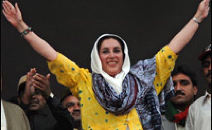 Bhutto waves to the crowd during an election campaign meeting in December.
