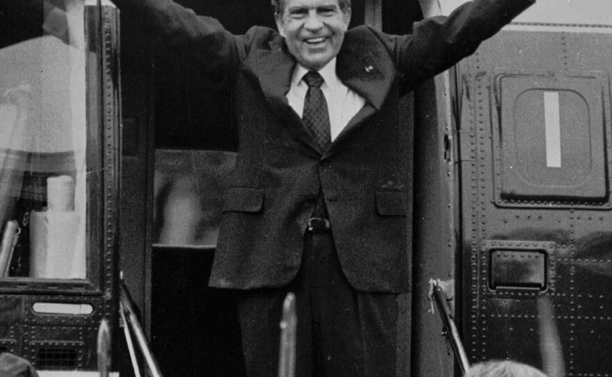 Richard Nixon says goodbye to members of his staff outside the White House as he boards a helicopter after resigning the presidency on Aug. 9, 1974.