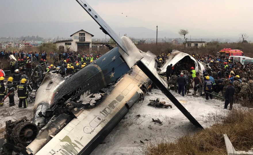 Rescue workers rushed to the scene of a US-Bangla Airlines jetliner that crashed at an airport in Kathmandu, Nepal, on Monday.