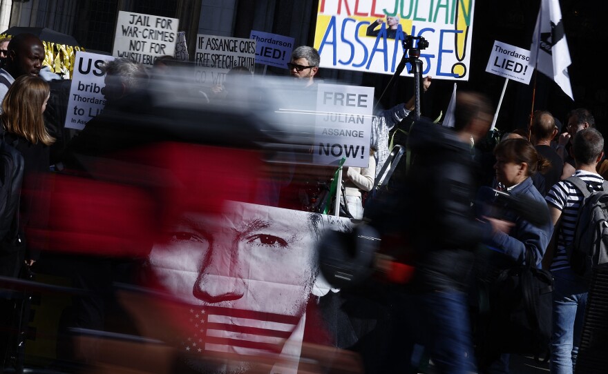 Supporters of WikiLeaks founder Julian Assange hold banners and placards as they protest in support of him, outside The Royal Courts of Justice, Britain's High Court, in central London on May 20, 2024.