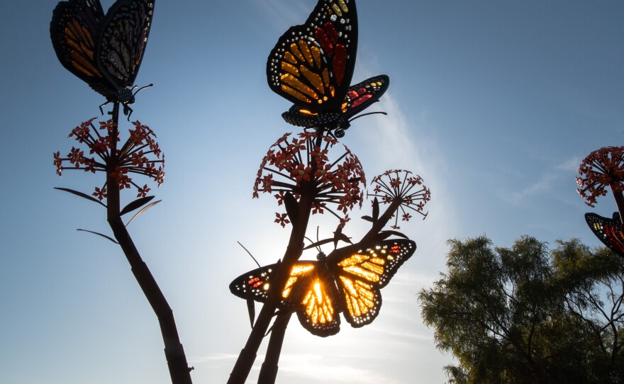 Alex Heveri's sculpture of monarch butterflies landing on milkweed flowers at The Flower Fields at Carlsbad Ranch, March 19, 2025.