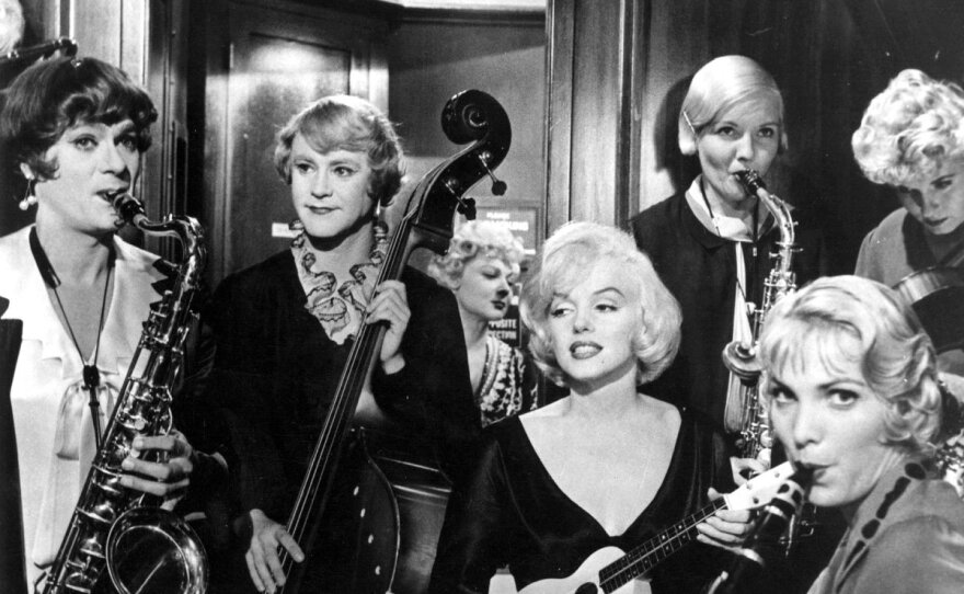 Tony Curtis and Jack Lemmon play musicians who have to dress like women to join an all-girl band to escape from mobsters. Marilyn Monroe co-stars in Billy Wilder's "Some Like It Hot."