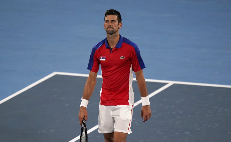 Serbia's Novak Djokovic  looks upset after he was defeated by Germany's Alexander Zverev during a semifinal match of the tennis competition on Friday at the Summer Olympics.
