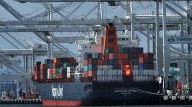 A container ship is unloaded at the Port of Oakland in Oakland, Calif., April 12, 2018.
