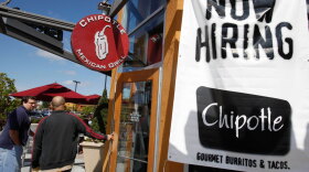 Customers walk into a Chipotle restaurant, in Mountain View, Calif. Private employers hired 159,000 workers in October.
