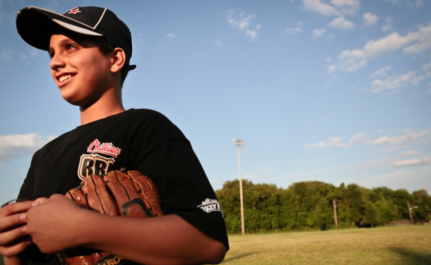 Miguel Perez at baseball practice at Pyne Poynt Park. Miguel lives with his grandmother Maria Reyes, one of the league's coaches.