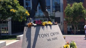 A Tony Gwynn statue beyond the outfield wall at Petco Park became a gathering spot for fans mourning the loss of the Hall of Fame baseball great, June 16, 2014.