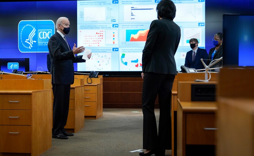 President Joe Biden speaks during a COVID-19 briefing at CDC headquarters in Atlanta, along with Dr. Rochelle Walensky. The administration has backed up public health guidance from the agency.
