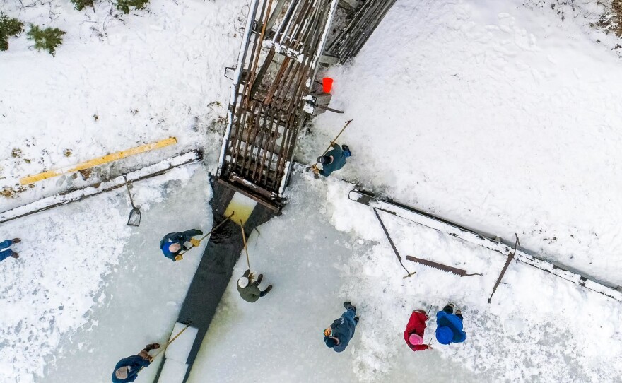 Birds eye view of the wooden ramp as the ice blocks are loaded.