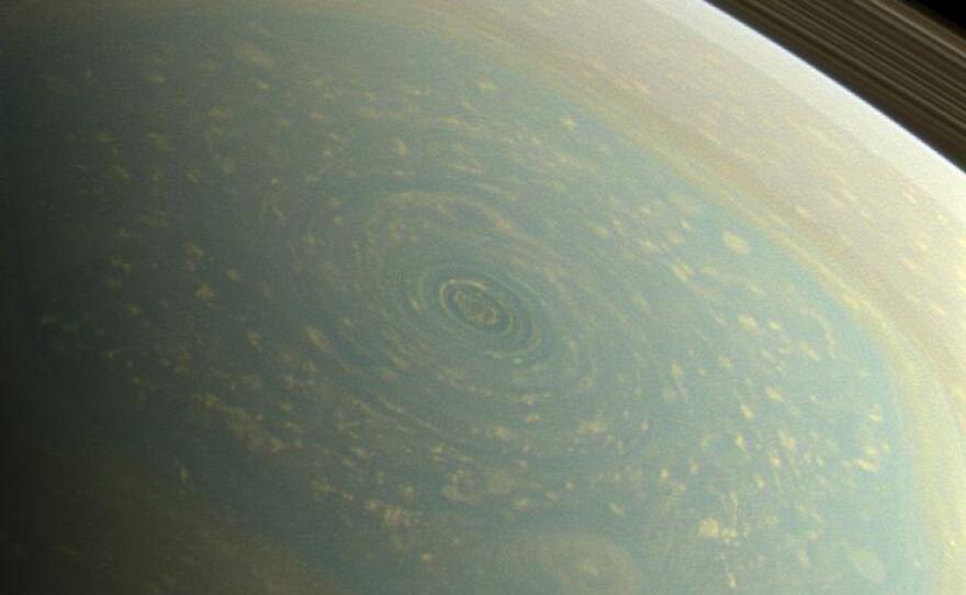 A huge storm is seen on Saturn's north pole, in this color image from NASA's Cassini spacecraft. NASA used red, green and blue spectral filters "to create this natural-color view, which is what the human eye would see if we were there at Saturn."