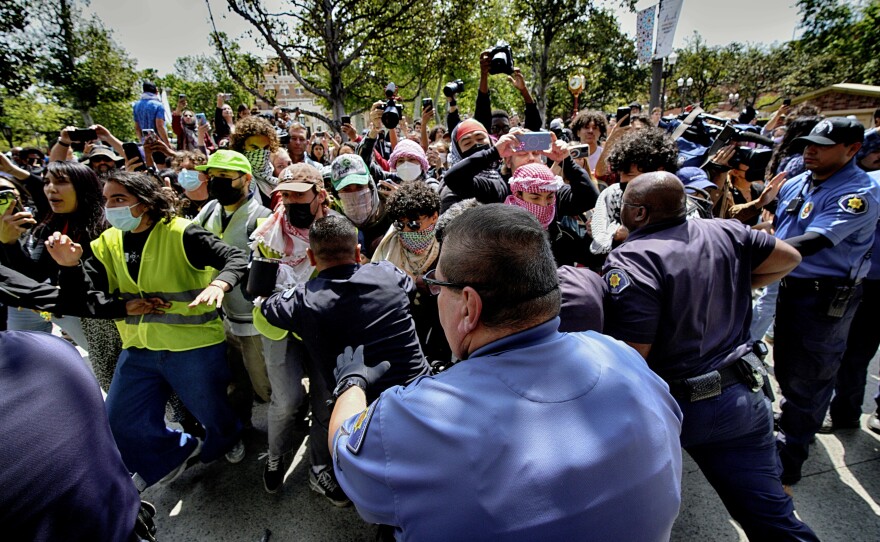 University of Southern California protesters push and shove University Public Safety officers as tempers get heated during a pro-Palestinian occupation on the University of Southern California campus on Wednesday in Los Angeles.