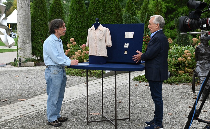 Ken Gloss (right) appraises a Holocaust survivors archive, ca. 1942, in Hamilton, N.J. on Oct. 6, 2021. 