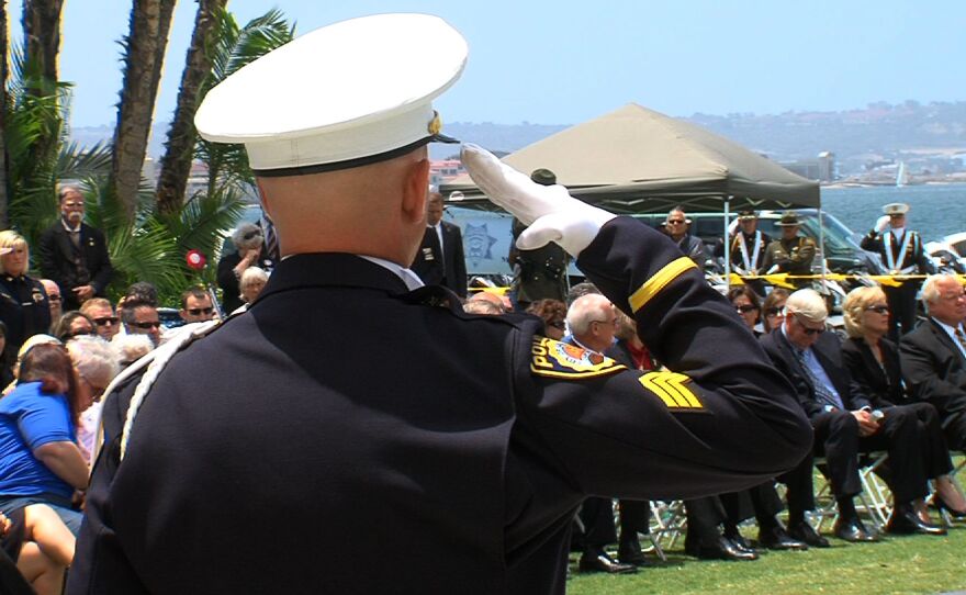 A San Diego police officer salutes during the 30th annual Law Enforcement Officers' Memorial Ceremony, May 7, 2014.