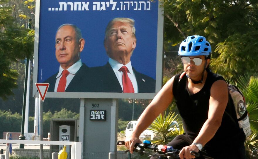 A billboard depicting Israel's Prime Minister Benjamin Netanyahu (L) and former President Donald Trump side by side on a billboard in the Israeli coastal city of Tel Aviv, on January 10, 2021.