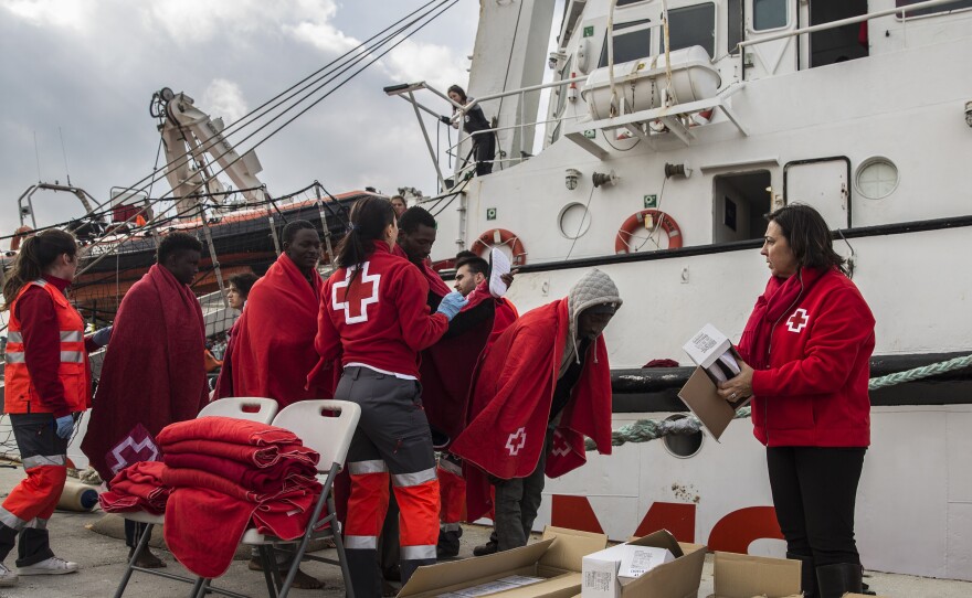 Migrants disembark in a port in southern Spain, after being rescued by a Spanish nongovernmental organization's rescue vessel in December. Spain saw an influx of migrants last year, as total migration across the Mediterranean fell.