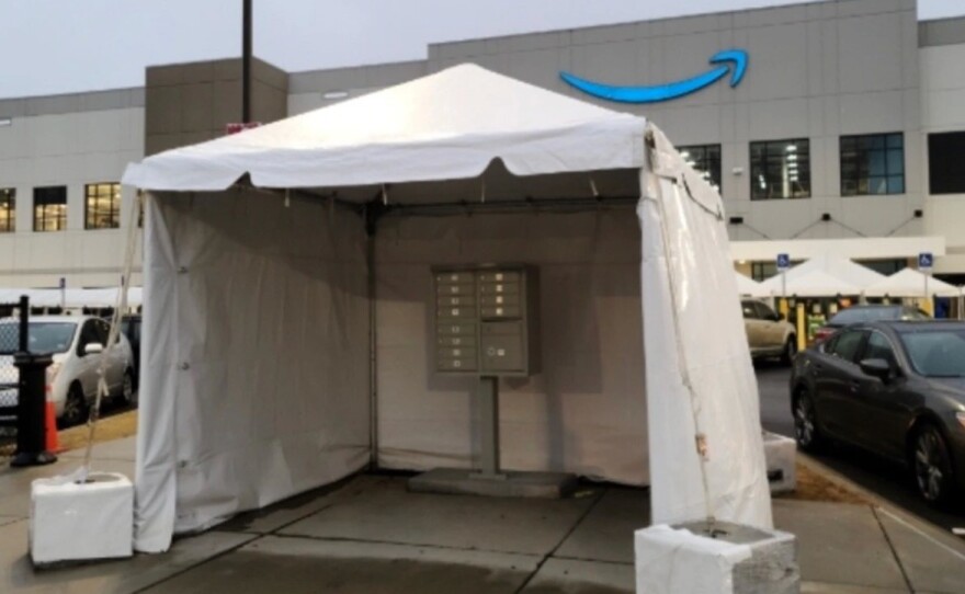 During last year's high-profile union vote, an Amazon-branded tent cloaks a mailbox outside the company's warehouse in Bessemer, Ala.