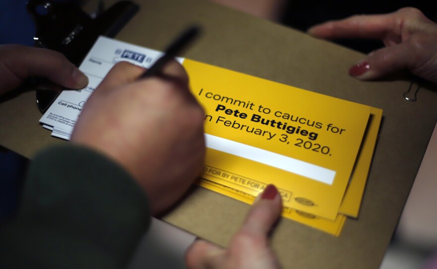 A person signs up to caucus for Democratic presidential candidate and former South Bend, Ind., Mayor Pete Buttigieg following a town hall meeting in Fort Dodge, Iowa.