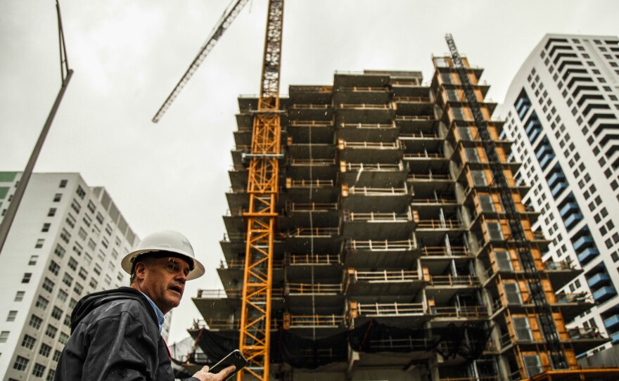 A construction worker at the Monad Terrace luxury development, a high-rise in Miami Beach that has been designed to withstand several decades of climate change and sea level rise.