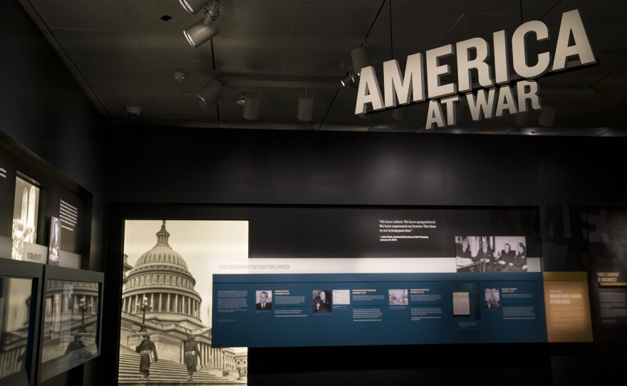 Scattered throughout the exhibit, rotating blocks with public opinion polls question U.S. engagement with war, refugees and persecuted people.